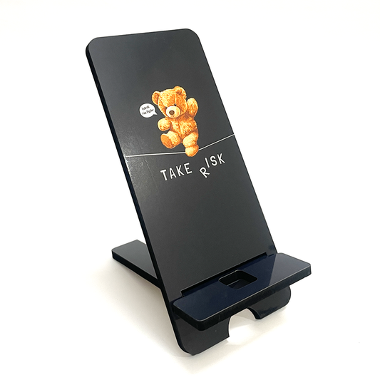 "Take Risk Inspirational Teddy Bear Wooden Phone Stand – Compact & Universal Smartphone Holder"